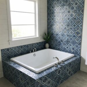 Drop-in bathtub with examples of stylish tile surround ideas for bathroom renovations.