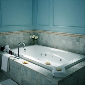 Elegant two person whirlpool bathtub featured in a bright and luxurious bathroom setting.
