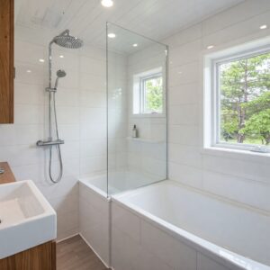 Efficient shower and tub combination in a modern tiny home bathtub.