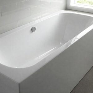 Close-up view of a clean, white porcelain undermount bathtub.