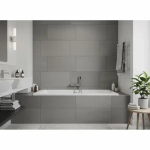 Contemporary bathroom displaying a large format gray tile bathtub surround, offering a sleek and minimalist aesthetic for bathtub tile surround ideas.