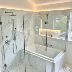 Luxurious bathroom design highlighting a deep soaking bathtub inside walk in shower with high-end fixtures.