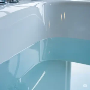 Essential tools and materials laid out for a professional epoxy bathtub refinishing project.