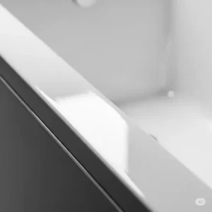 Close-up view of the durable, high-gloss acrylic material used for a bathtub surround, highlighting its non-porous finish.