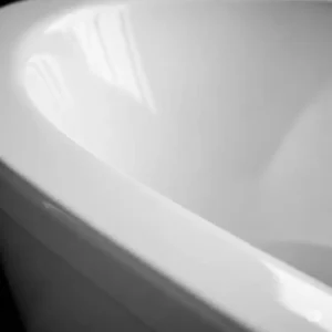 Close-up of a durable porcelain china bathtub surface, emphasizing its long-lasting quality and smooth finish.