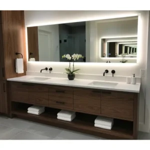 A spacious double-sink luxury bathroom vanity, perfect for a master suite, featuring an integrated lighting system.