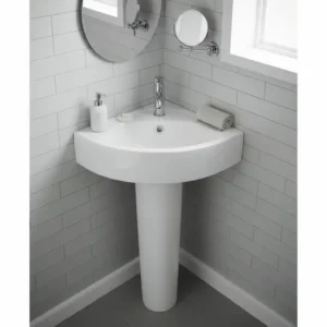 A space-saving corner sink mounted on a pedestal, perfect for small sinks and vanities for small bathrooms.