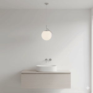 A single, sleek globe-shaped bathroom pendant light fixture provides a minimalist, yet elegant, lighting solution over a bathroom sink.