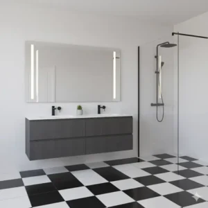 A bold, graphic black and white tile floor bathroom with contrasting decor