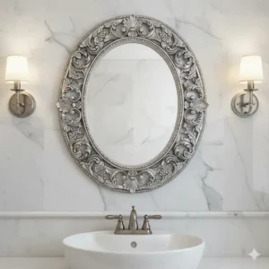"Artistic oval bathroom mirror featuring an ornate silver frame, serving as a decorative focal point."