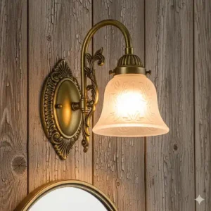  An antique brass bathroom sconce with an ornate shade, mounted on a rustic wood wall, adding a touch of vintage charm.