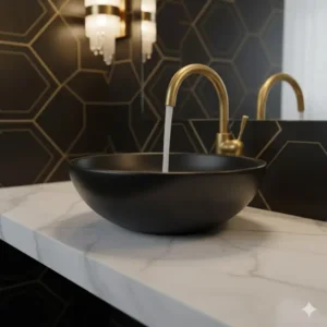 Close-up of an elegant gooseneck gold faucet mounted over a sleek black sink in a sophisticated powder room. 