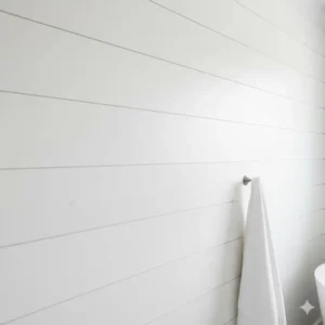 Detail of white shiplap paneling providing texture in a setting for the white modern farmhouse bathroom design.