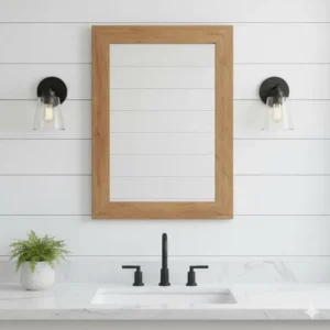 Rectangular farmhouse bathroom mirror mounted on a classic white shiplap wall in a primary bathroom. 
