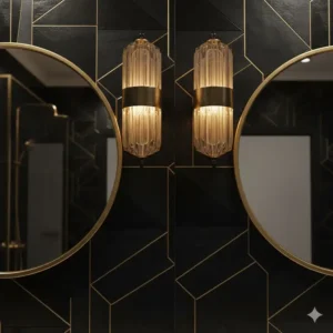 Decorative black and gold wall sconces providing warm, ambient lighting above a mirror in a luxurious black and gold bathroom. 