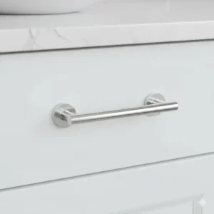 Bright polished chrome D-pull handle installed on a cabinet, demonstrating functional and durable bathroom unit handles.